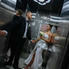 A creative and intimate shot of a newlywed couple in an elevator in Dubai. I find unique angles and locations to make every part of your wedding day memorable.