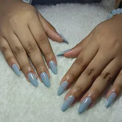 These long, stiletto extensions in a shimmering powder blue are so dreamy. A simple color can make a huge statement with the right shape.