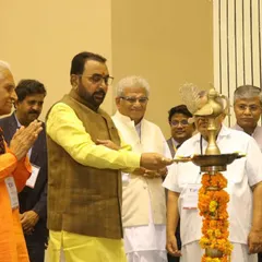 Participating in the ceremonial lamp lighting at the Yoga Mahotsav. These traditions mark the auspicious beginning of an event dedicated to wellness and peace.