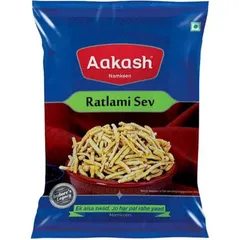 From the heart of Indore, this is Aakash Namkeen's Ratlami Sev. It's a spicy and flavourful chickpea flour noodle snack, perfect for adding crunch to your chaat or enjoying on its own.