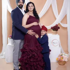 A portrait of a growing family. Including the older sibling in a maternity shoot is a wonderful way to capture the family dynamic right before a new baby arrives.
