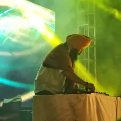 As a DJ, I don't just play music; I create unforgettable journeys for the audience. Here I am at the console, crafting the soundtrack for the night.