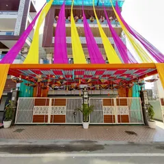 Another angle of the complete house facade decoration. This shows how the entrance structure and the building drapes are integrated into a single, cohesive design.