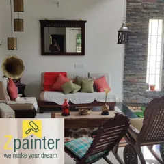 Another view of the bright and welcoming living room, showcasing the clean paint job around the mirror and light fixtures.