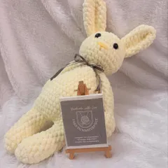 A large, floppy bunny made from plush yarn, perfect for snuggling. I can make these in any color you choose.