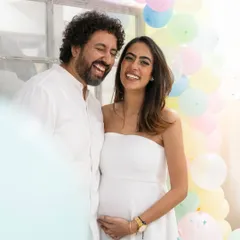 The happy couple sharing a laugh at their baby shower. My approach is to capture these candid moments of connection that truly reflect the joy of the occasion.