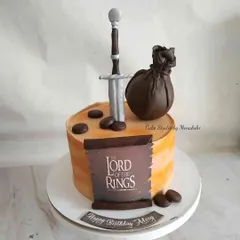This cake is based on the famous series, Lord of the Rings. I handcrafted the sword and other iconic elements for Abhay's birthday.
