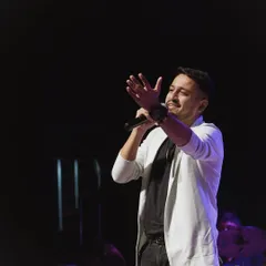 Engaging with the crowd during an acoustic show. Even in a quieter setting, I love to interact with the audience, making them feel like they are part of the musical journey.