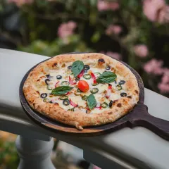 Our food is a story in itself. Imagine enjoying a freshly baked pizza, with the cool Bangalore breeze on one of my balconies. It's these simple, perfect moments that define the experience here.