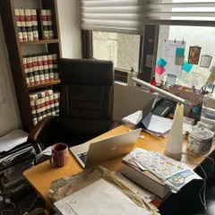 My desk at the start of the year, surrounded by the familiar clutter of law books, files, and coffee. This is where the strategies are built and the arguments are drafted.