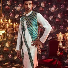 Our fusion wear collection blends tradition with contemporary design, as seen in this asymmetrical long jacket with striking slanted stripes for a modern silhouette.