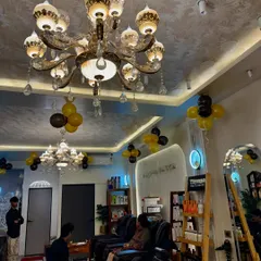This is our dedicated pedicure and relaxation area. You can sit back and unwind under our beautiful chandeliers while we take care of your hands and feet.