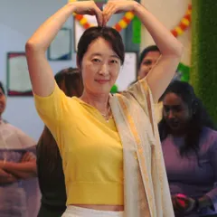 A student joyfully participates in our Onam celebration. We create an inclusive environment where everyone feels welcome to join in the festivities.