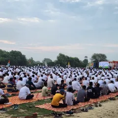 A ground-level view of the massive turnout for the public yoga session. My goal is to make yoga accessible and enjoyable for every single person in the crowd.