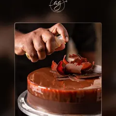 The final touch of artistry on a chocolate celebration cake. I believe presentation is just as important as taste, and I love adding elegant details like this handcrafted chocolate flower.