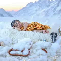 Om Namah Shivaya. For Mahashivaratri, I created this serene Bala Shiva theme with a baby sleeping peacefully in a snowy Kailash-inspired setting, complete with a miniature Trishul and Damaru.