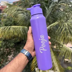 A vibrant purple personalized water bottle with a sipper lid. The name is elegantly engraved down the side.