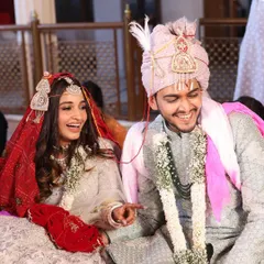 A candid moment of laughter during the pheras. This bride chose a beautiful white and silver lehenga, and we complemented it with a soft, natural makeup look.