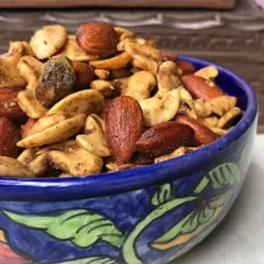 This is my Dry Fruit Bhel, a delicious combination of rich nuts and a tangy chaat masala flavor. It's a unique snack that enhances the natural taste of the dry fruits.