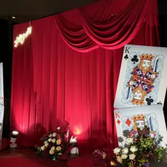 We transformed a milestone birthday into a glamorous Casino Night, where every detail, from the rich red drapes to the custom life-sized playing cards, was designed for an evening of sophisticated fun and high-stakes excitement.