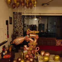 Another view of the 3rd anniversary home decor, showing how the rose gold and gold balloons complement a typical living room space. I ensure the setup fits your home's layout perfectly.