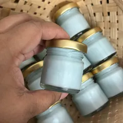 These cute mini glass jars with golden lids are a perfect budget-friendly option for return favors. This one is filled with a lovely light blue soy wax.