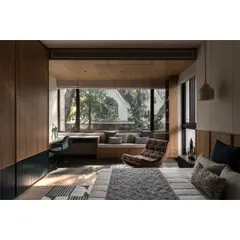 A full view of one of the kids' bedrooms, designed to be a sanctuary for learning and play. The room features a dedicated desk, a comfortable reading chair, and a large window that floods the space with natural light.