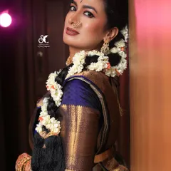 I've had the pleasure of working with many Sandalwood celebrities, like the wonderful Shwetha Srivatsav here. This look showcases my expertise in creating camera-ready makeup that is flawless for professional photoshoots and events.