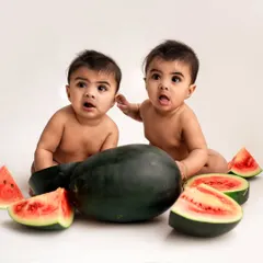 A fun and fruity watermelon-themed shoot for these twin boys. Their identical looks of surprise are absolutely priceless and make for a memorable photo.