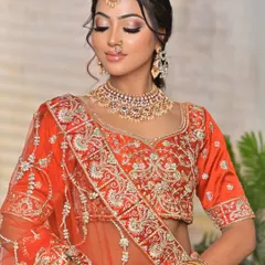 This shot showcases the full neckline and how the jewellery sits against the embroidered blouse. You can also see the matching earrings and the stack of bangles that complete this traditional bridal look.