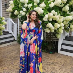 Mehendi vibes in a floral kaftan. The makeup for this look was fresh and breezy, with a focus on glowing skin and a soft eye to match the daytime festivities.
