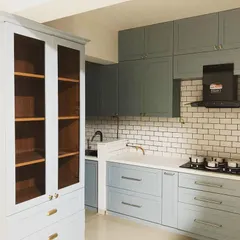 Blending traditional design with a classic English finish. This beautiful pastel blue kitchen features subway tiles and a separate crockery unit, creating a natural flow.