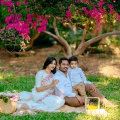 We begin our outdoor sessions by creating a comfortable, classic family portrait. Seated on a picnic blanket under a flowering tree, this family’s coordinated outfits and relaxed smiles set a warm and inviting tone for the entire shoot.
