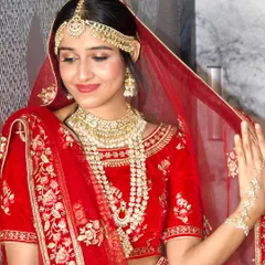 A classic red lehenga calls for a timeless makeup look. Here, I created a radiant and sophisticated style for the bride, ensuring her makeup was flawless and long-lasting for her main wedding ceremony.