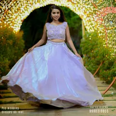 A beautiful shot of our iridescent lavender lehenga, perfect for a pre-wedding event or sangeet. The flowing skirt is designed to create a magical twirling effect in photos and videos.