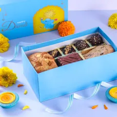 A closer look at one of our delectable Diwali dessert boxes. This one features a mix of our signature cookies, brownies, and chocolate truffles, perfect for sharing.