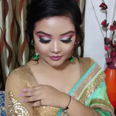 A close-up of a very creative and colorful eye makeup look. I used a mix of pink, green, silver, and white to create this beautiful, artistic design.