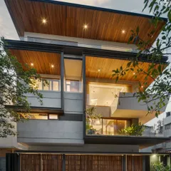 The finished Timber Edge residence. The transformation is defined by a new, layered facade featuring timber, projecting balconies, and refined detailing that completely alters its street presence.