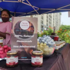 My promise to you is simple: 100% natural, homemade, and non-adulterated food. Here are some of my pickle jars and sweets on display, ready for you to try.