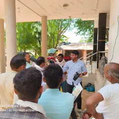 Our team member, holding a product sample, engages with a group of farmers in Jaipur. These informal village meetings allow for open dialogue and help us understand the specific needs of the local farming community.