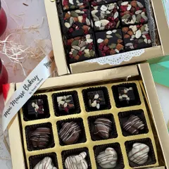 Two of my most popular Diwali gift boxes side by side. You can choose between the assorted nut-filled chocolates or the decadent fruit and nut bark, or get both.