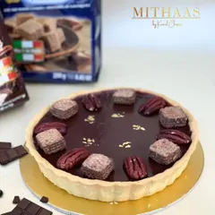 I've combined two favorites into one ultimate tart sensation. A buttery tart shell is filled with my signature chocolate mousse and topped with Loacker wafers and pecans.