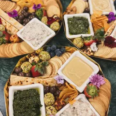 Our cheese and dips platters are perfect for weekend get-togethers. This hexagonal platter features a variety of our house-made dips, cheese balls, crackers, and fresh fruit, and can be customized to your liking.