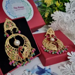 Meet my मोर चंदबाली (Peacock Chandbali). These gold-plated Jadau earrings feature a detailed peacock motif with colourful stones, making them a true statement piece for any celebration.