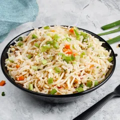 Our Vegetable Fried Rice, a simple and comforting dish. It's stir-fried with fresh carrots and spring onions to complement any of our main dishes.