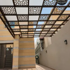 A close-up of a laser-cut pergola ceiling with an alternating pattern of solid and decorative panels. This design offers a unique aesthetic and is perfect for carports or covered walkways where both shade and style are desired.