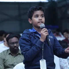Confidence is built by having a voice. This young innovator is captured engaging with the audience at a competition, asking thoughtful questions. We empower students to not just build projects but to also lead conversations and think critically about technology.