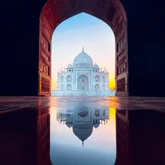 A classic shot of the Taj Mahal, perfectly framed by an archway with its reflection in a puddle. This is one of my top clicks, showcasing my eye for creative compositions.