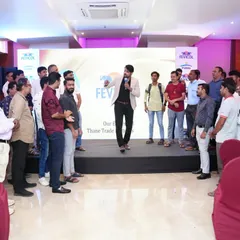Getting the dealers on their feet for an interactive session. Even in a formal setting, I find ways to incorporate light activities to keep the energy levels high and the audience attentive.