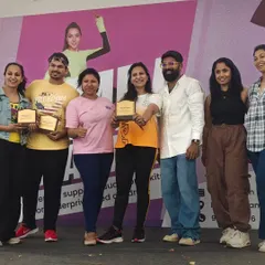 On stage with fellow instructors and organizers after a successful fundraising event. It takes a team to make a difference.